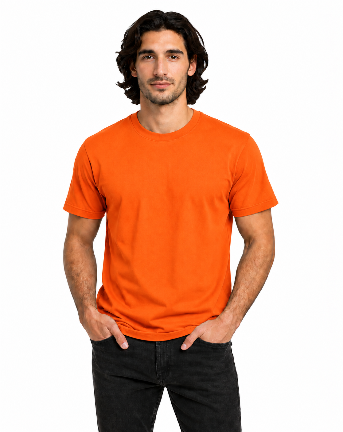 A man wearing a bright orange crew-neck t-shirt and black jeans, standing against a plain white background.