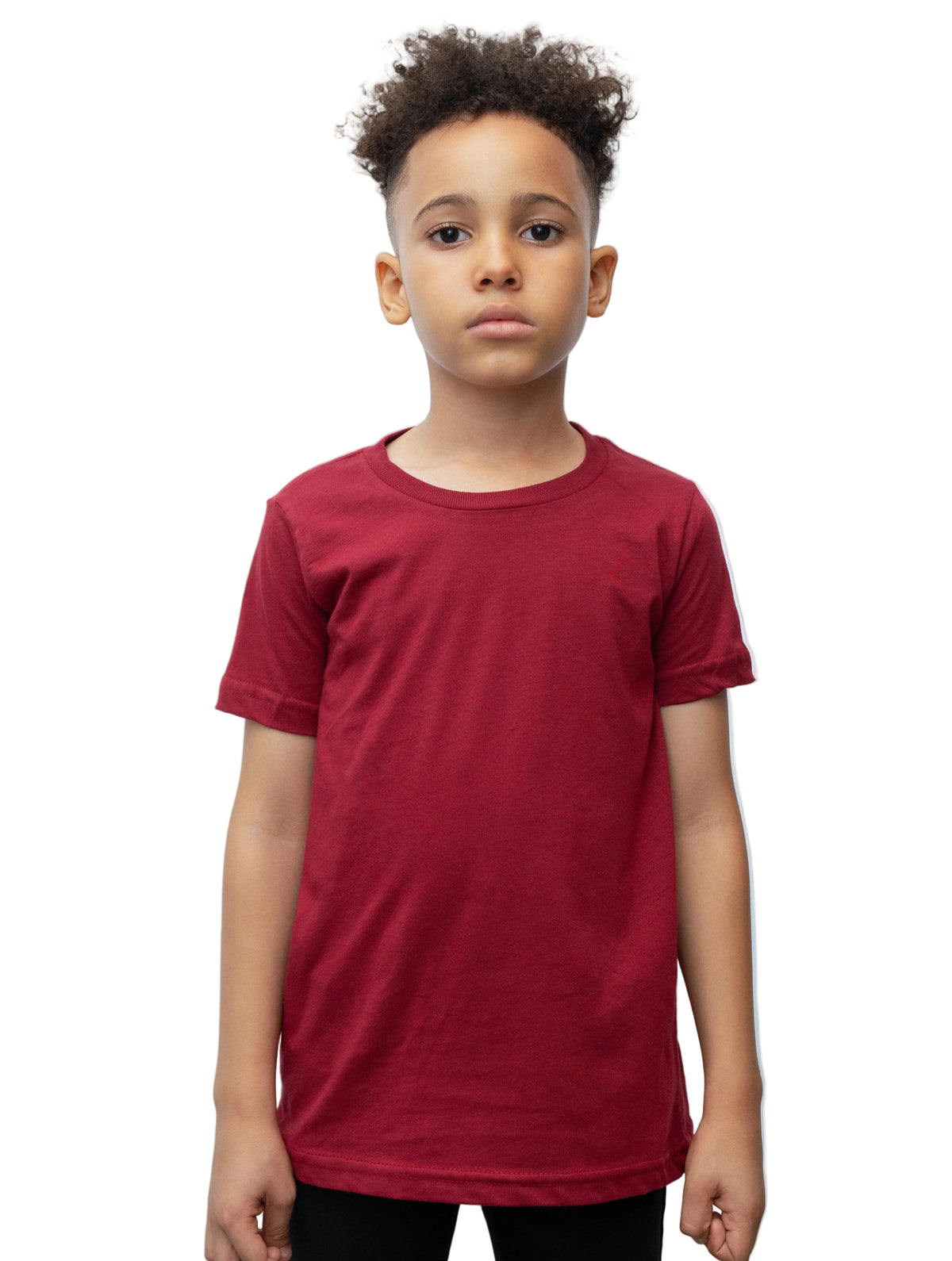 Child wearing a red t-shirt against a plain background