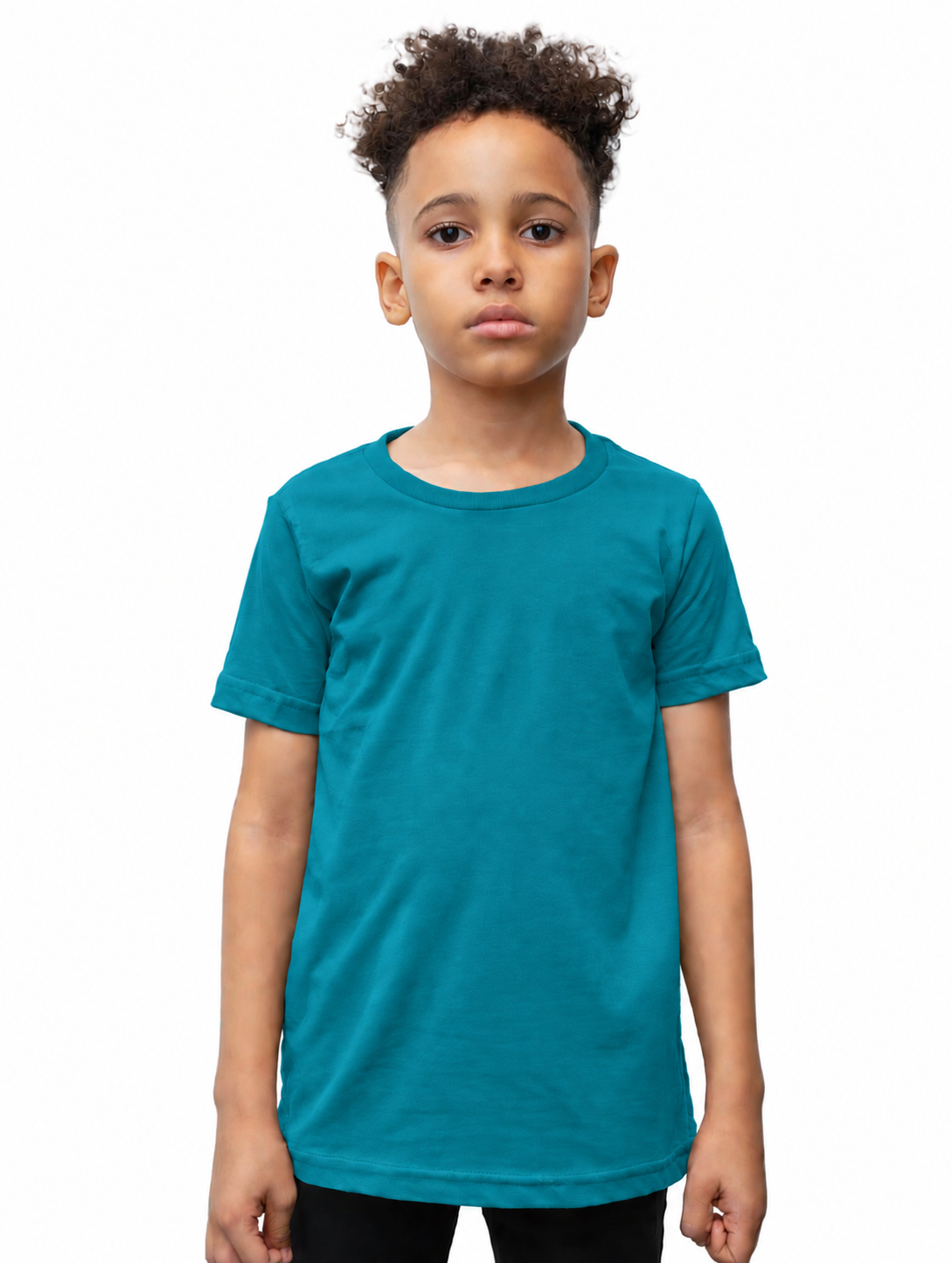 A young boy with curly dark hair wearing a solid teal short-sleeve crewneck t-shirt, standing against a plain white background.