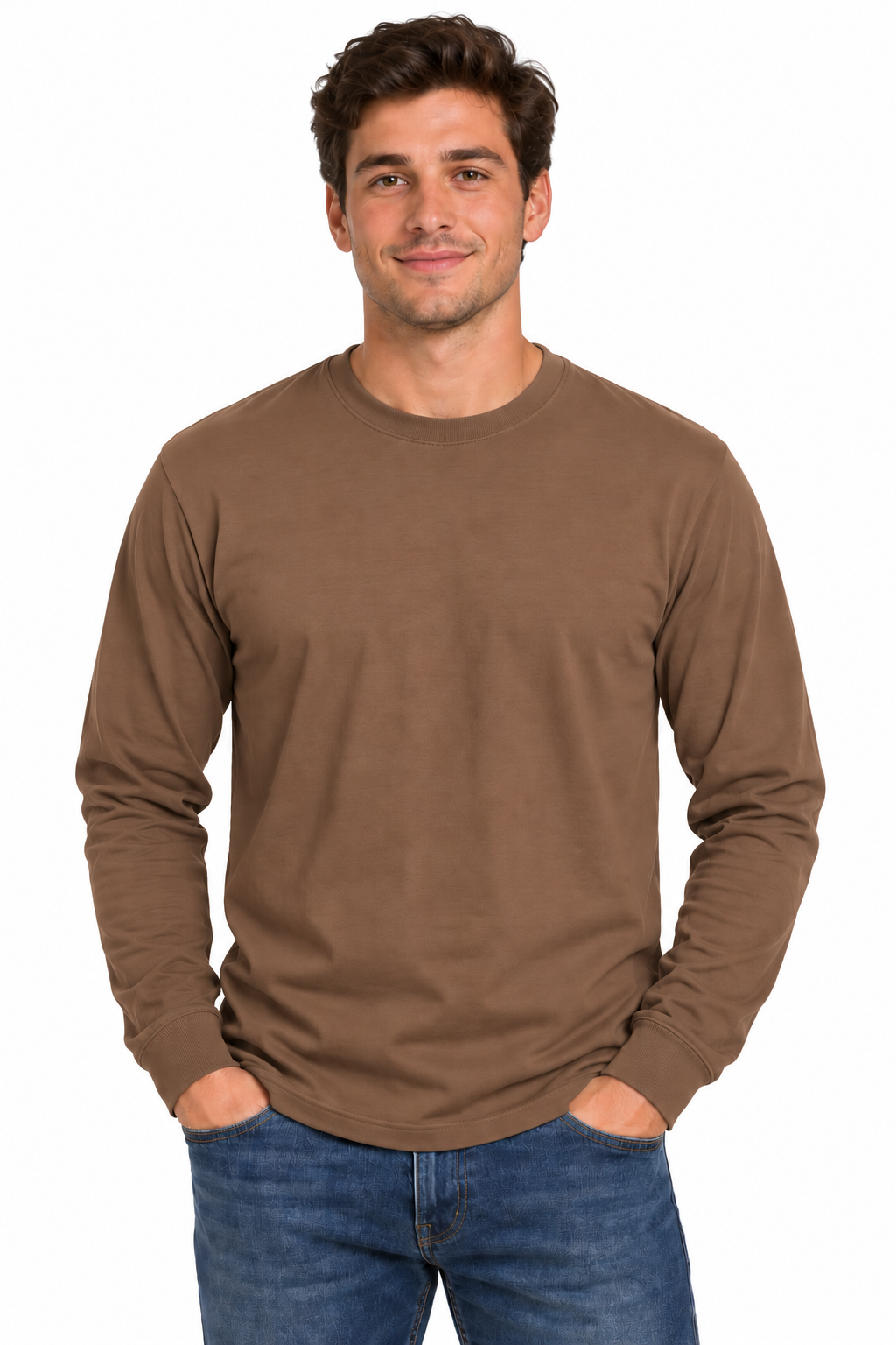 A man wearing a plain brown long-sleeve crewneck t-shirt and blue jeans, standing against a solid white background.