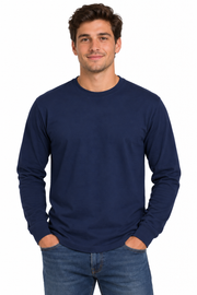A man wearing a solid navy blue long-sleeve crewneck t-shirt and blue jeans, standing against a plain white background.
