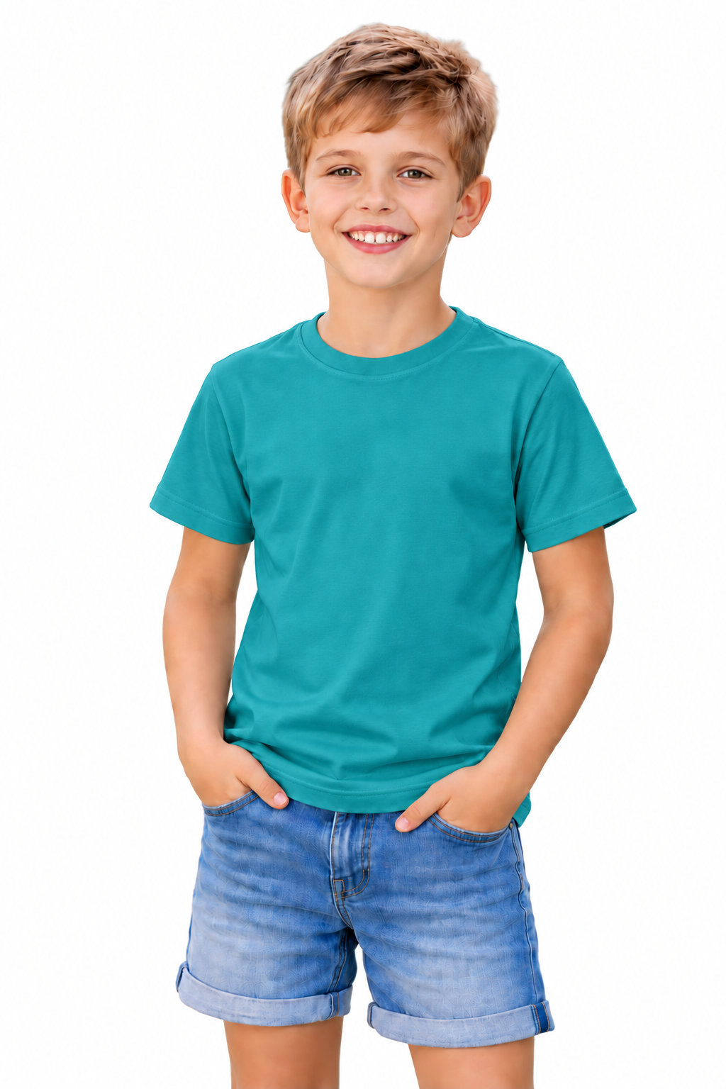A young boy smiling and wearing a solid teal short-sleeve t-shirt and blue denim shorts, standing against a plain white background.