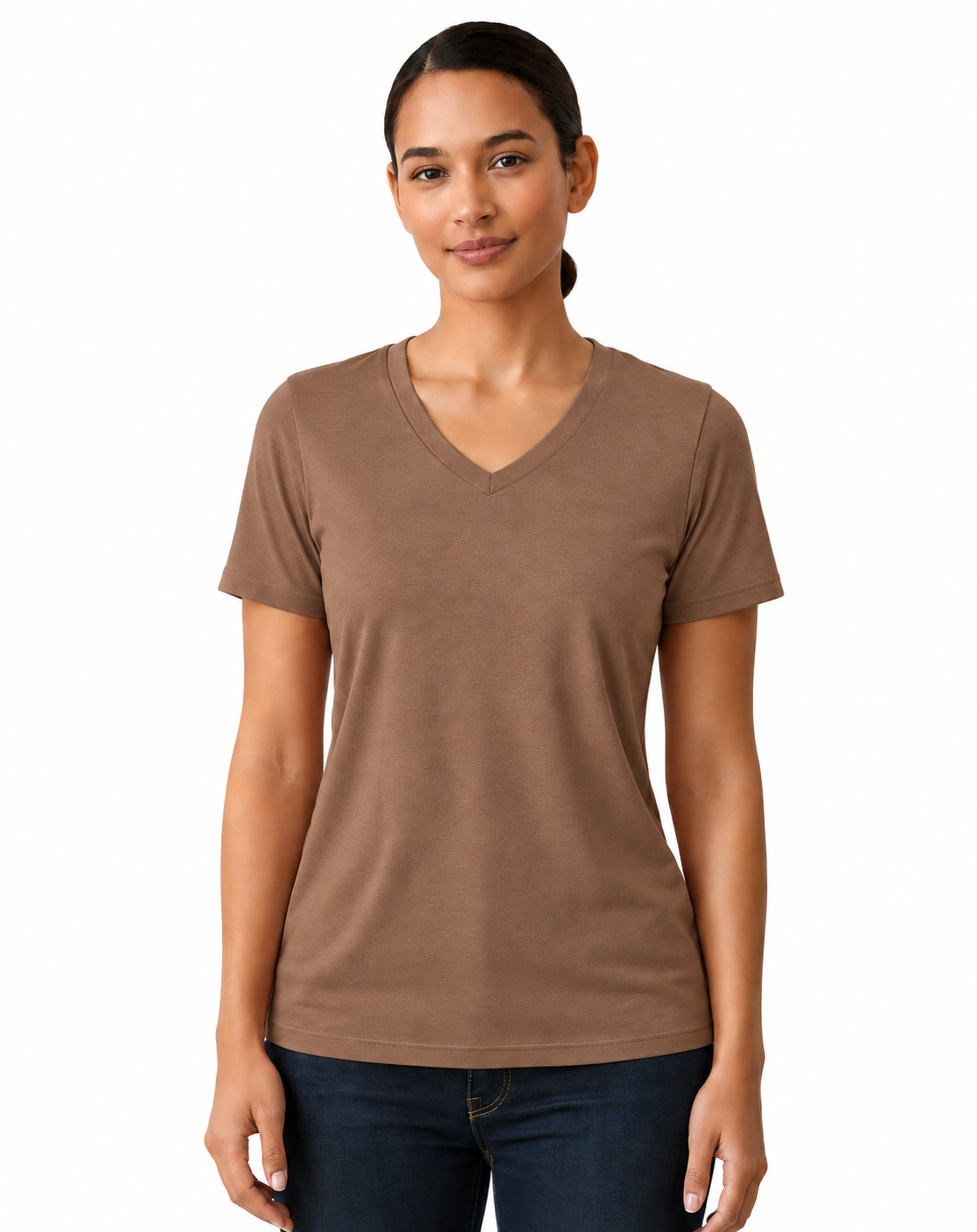 A woman modeling a short-sleeve V-neck t-shirt in a solid medium brown color, paired with dark blue jeans, against a plain white background.