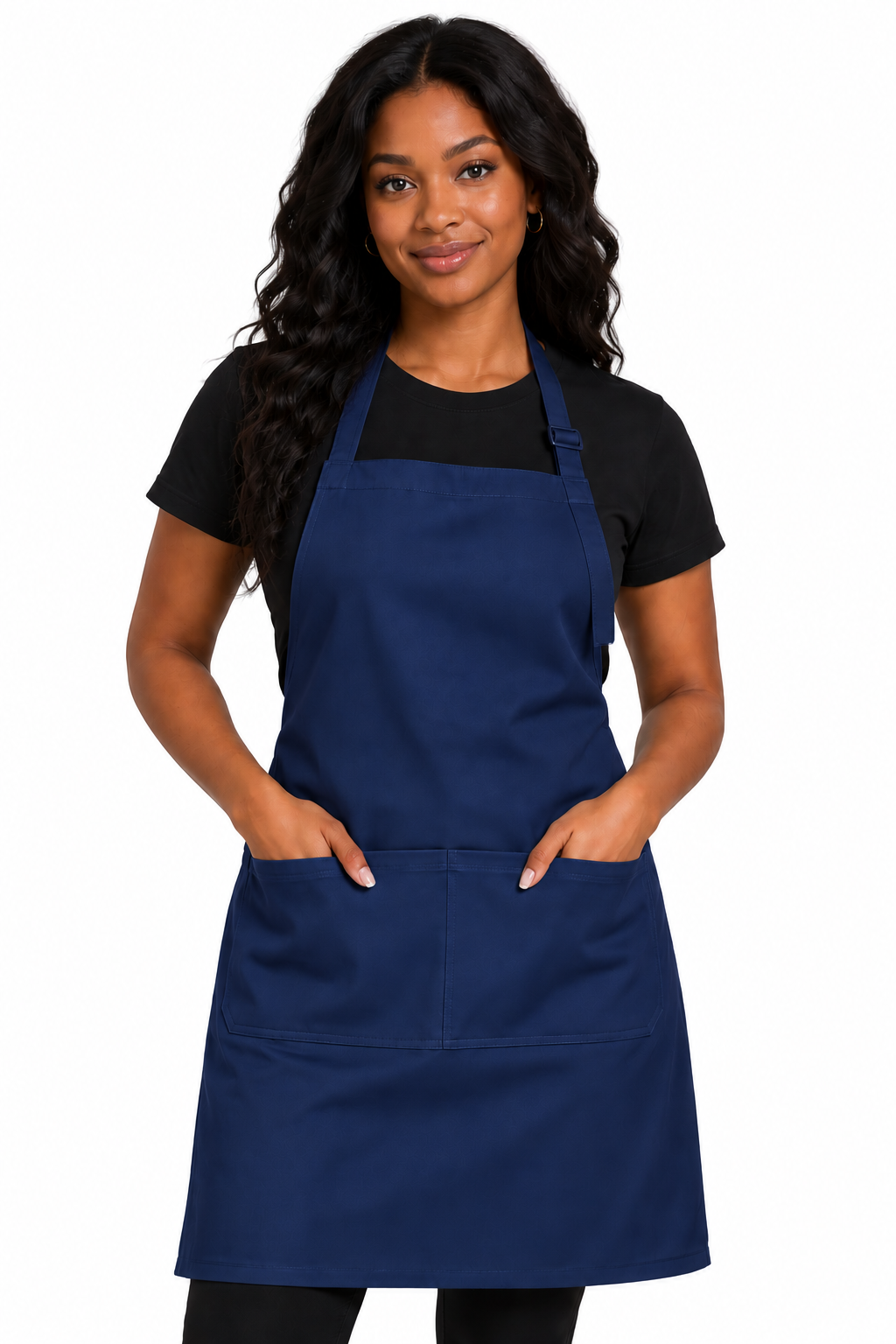 A woman modeling a navy blue bib apron with two front pockets over a black t-shirt, set against a plain white background.