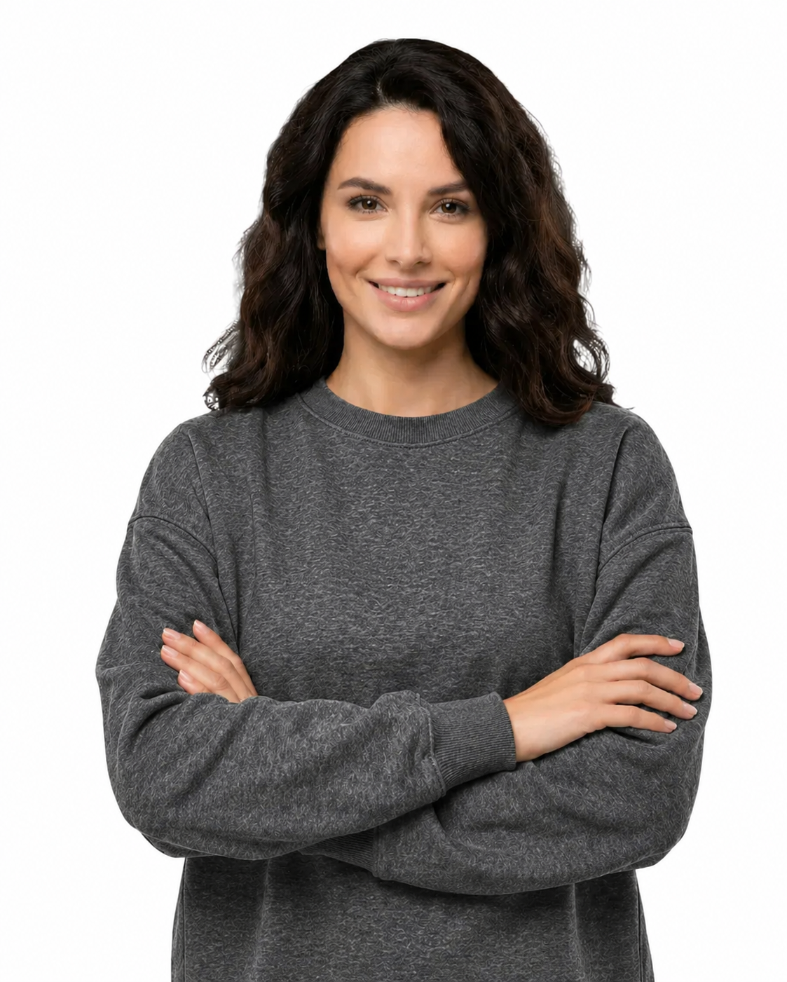 Woman wearing a gray sweater with arms crossed on a white background