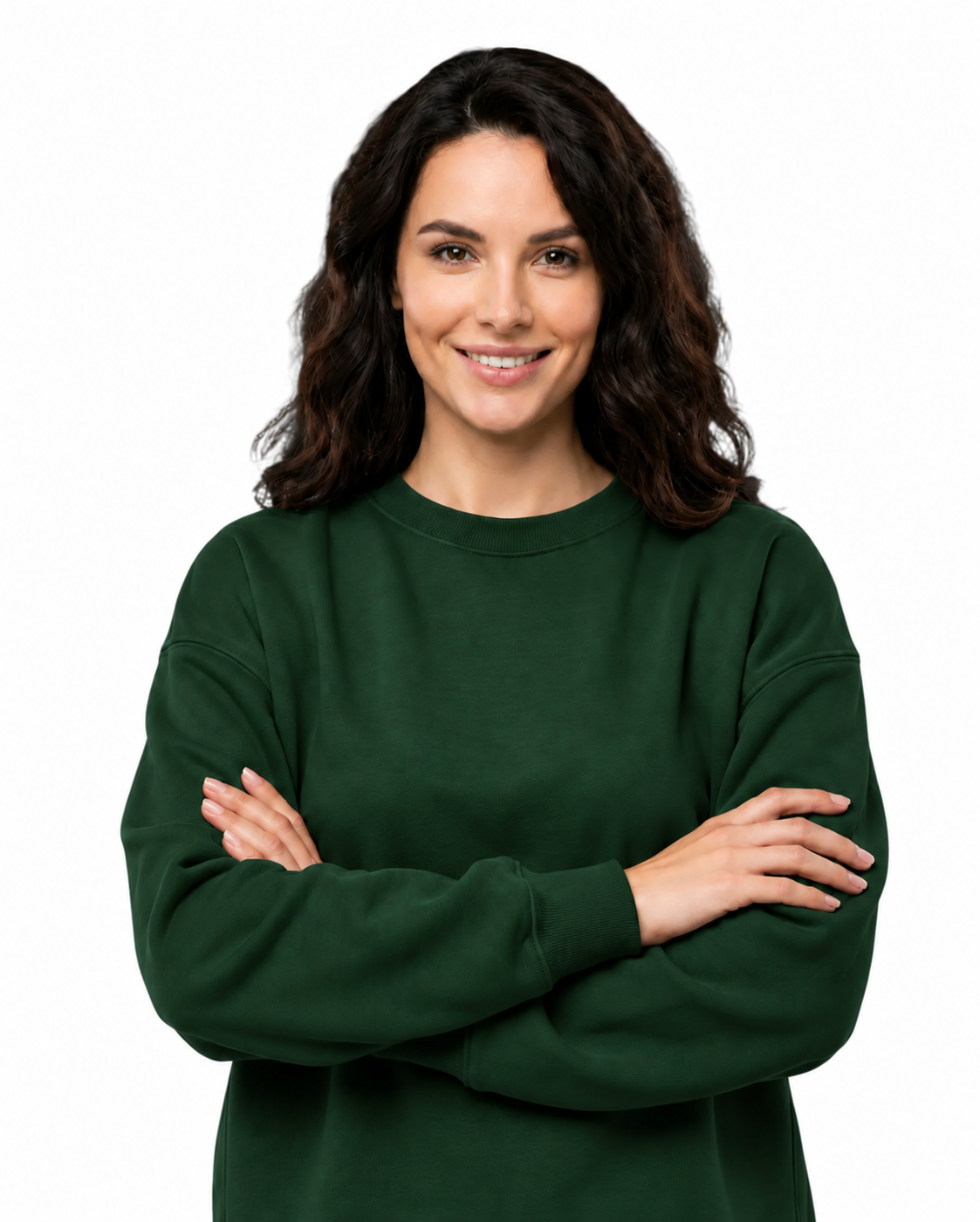 A woman with dark wavy hair wearing a dark green crewneck sweatshirt, standing with her arms crossed against a solid white background.