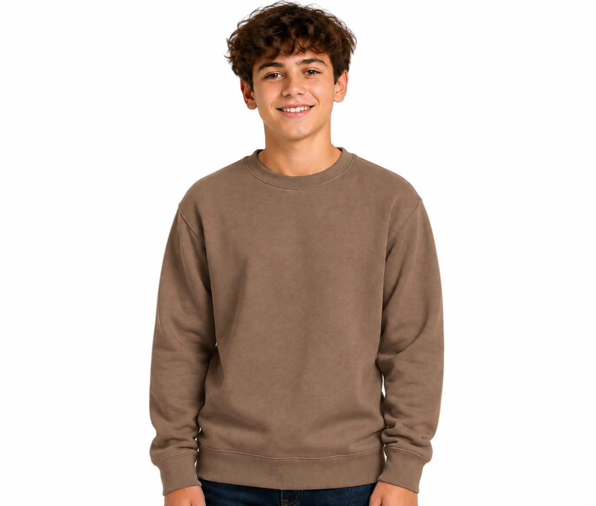 A young man smiling and wearing a solid brown crewneck sweatshirt, photographed against a clean white background.
