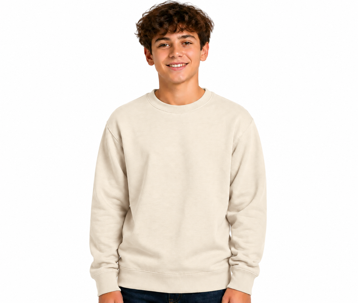 A smiling young man wearing a plain cream-colored crewneck sweatshirt, standing against a solid white background.