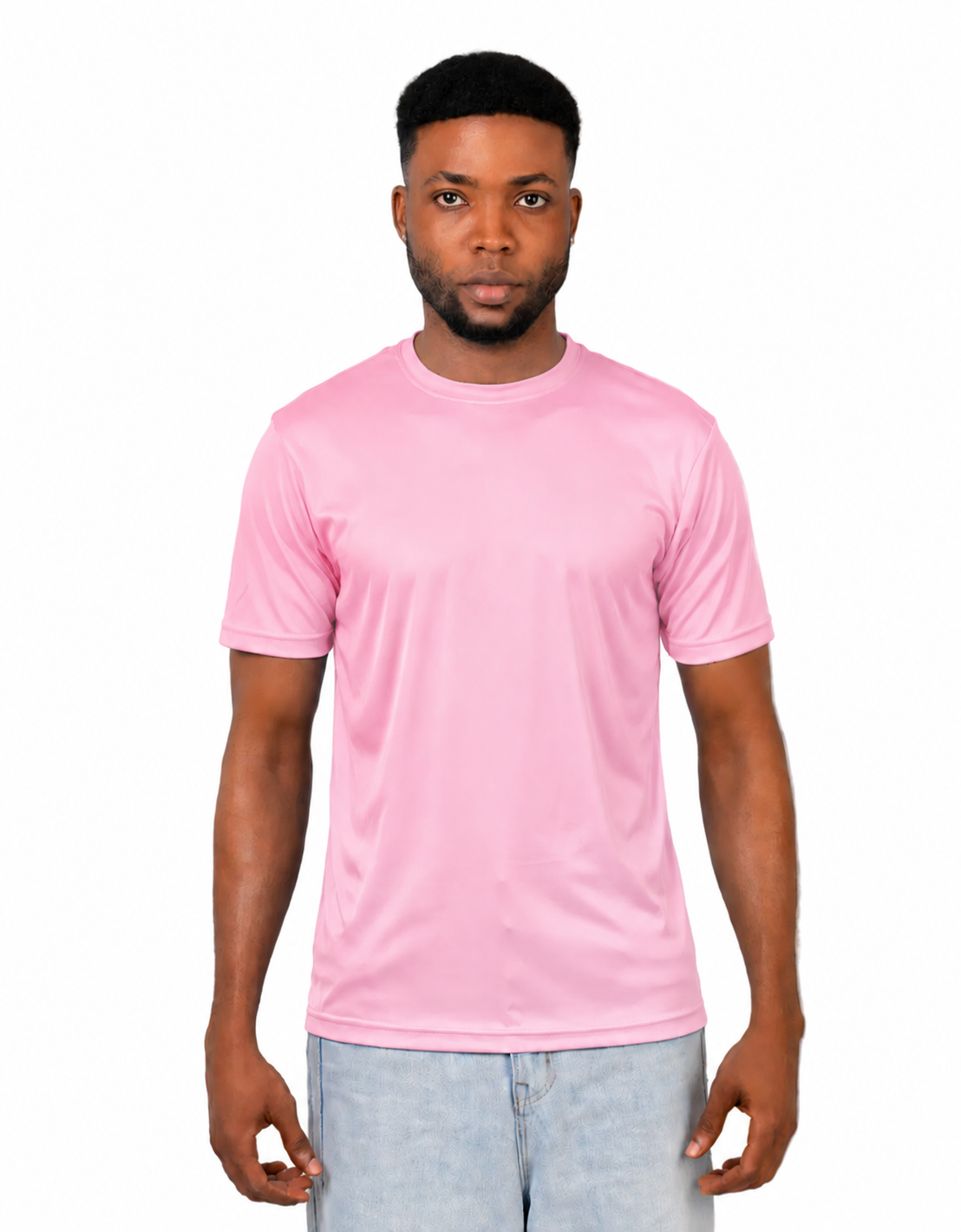 A man wearing a light pink short-sleeve crewneck t-shirt and light blue jeans, standing against a solid white background.