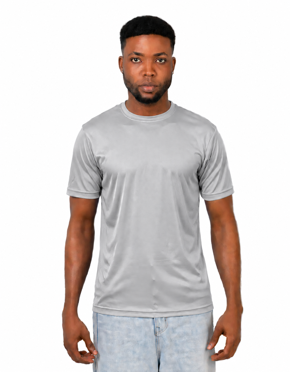 A man wearing a light gray short-sleeve crewneck t-shirt and light blue jeans, standing against a solid white background.