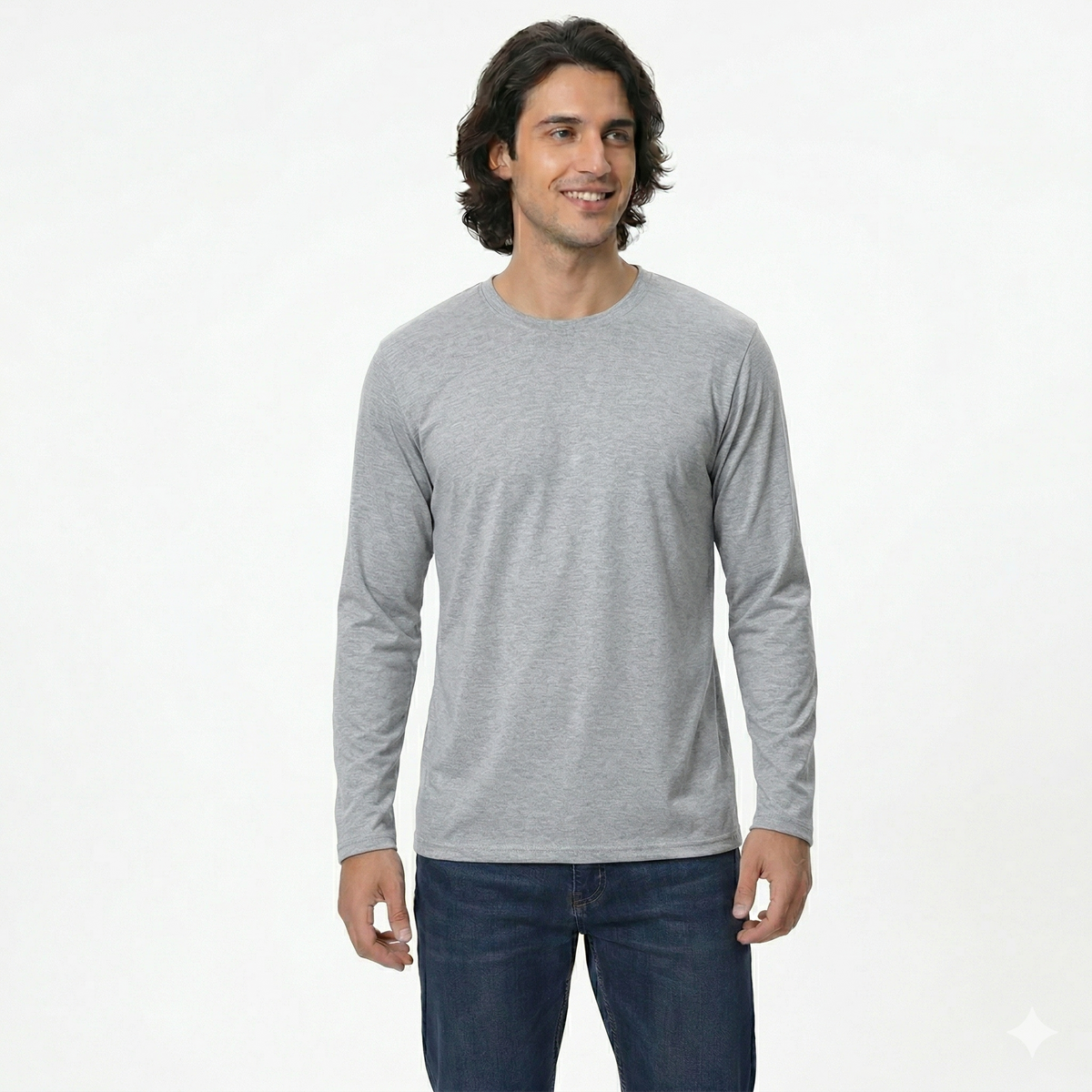 Man wearing a gray long-sleeve shirt and blue jeans on a white background