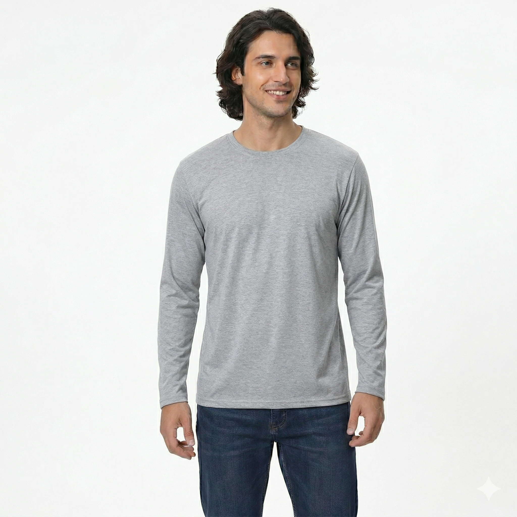 Man wearing a gray long-sleeve shirt and blue jeans on a white background