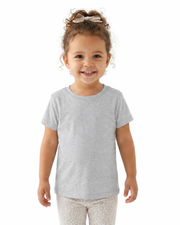 Child wearing a gray t-shirt and white pants with a pattern on a white background