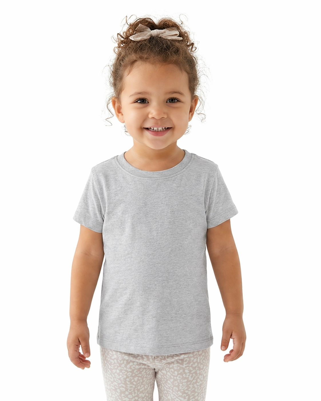 Child wearing a gray t-shirt and white pants with a pattern on a white background