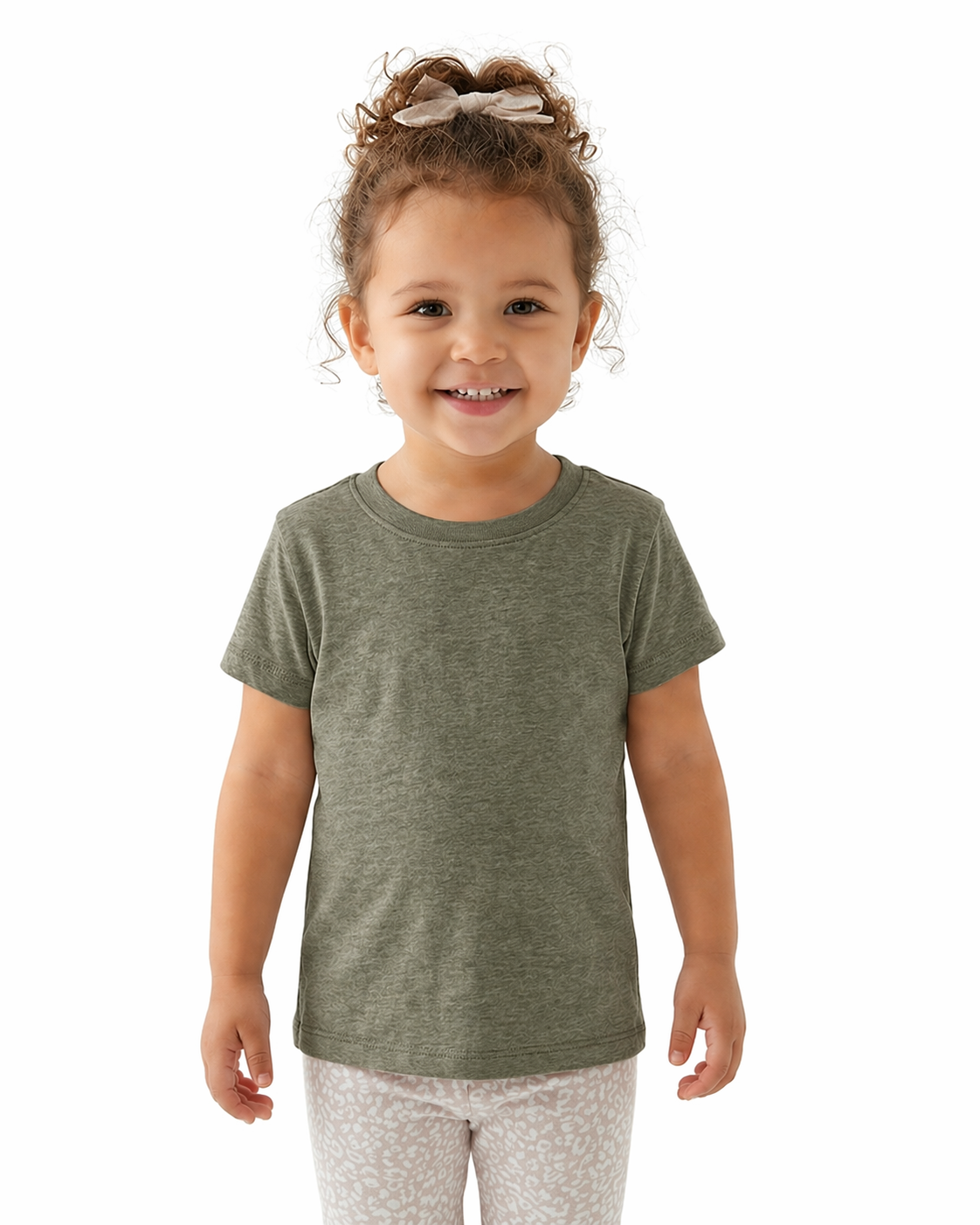 Child wearing a green t-shirt on a white background