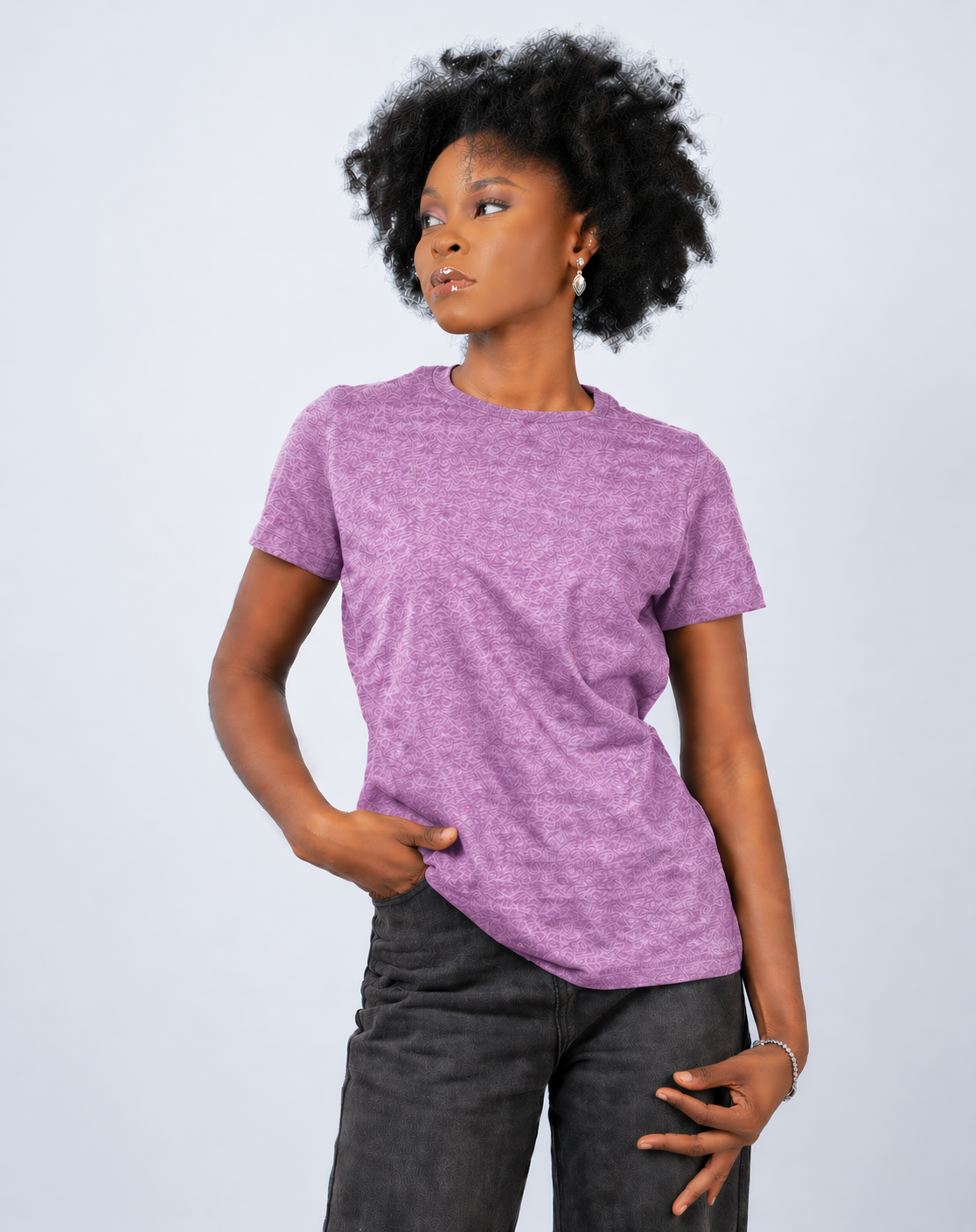 Person wearing a purple t-shirt and dark pants on a light gray background