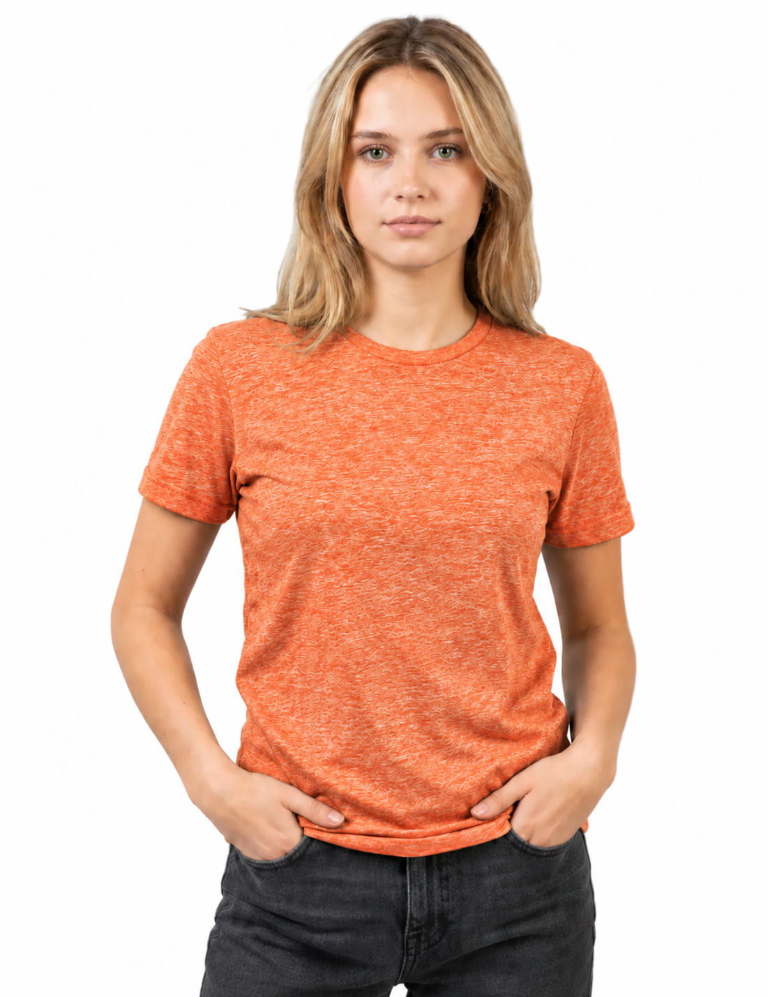 A woman with blonde hair wearing a heathered orange crewneck t-shirt and dark gray jeans, standing against a plain white background.