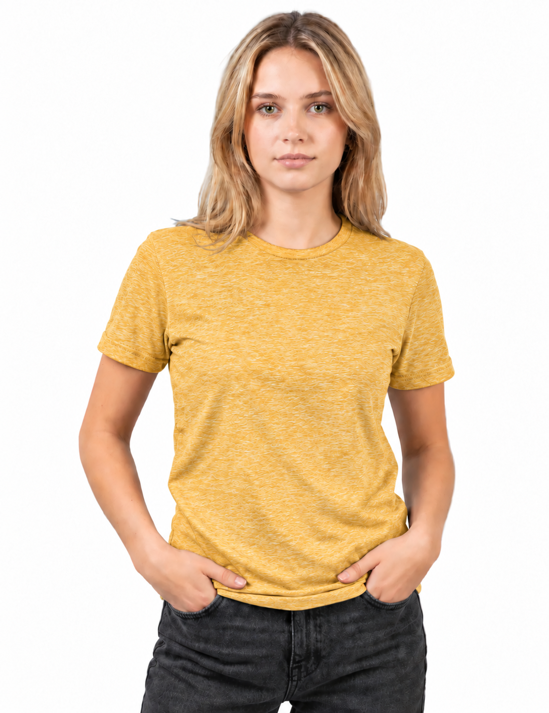 A woman with blonde hair wearing a short-sleeve crewneck t-shirt in a heathered mustard yellow color, paired with dark gray jeans, standing against a plain white background.