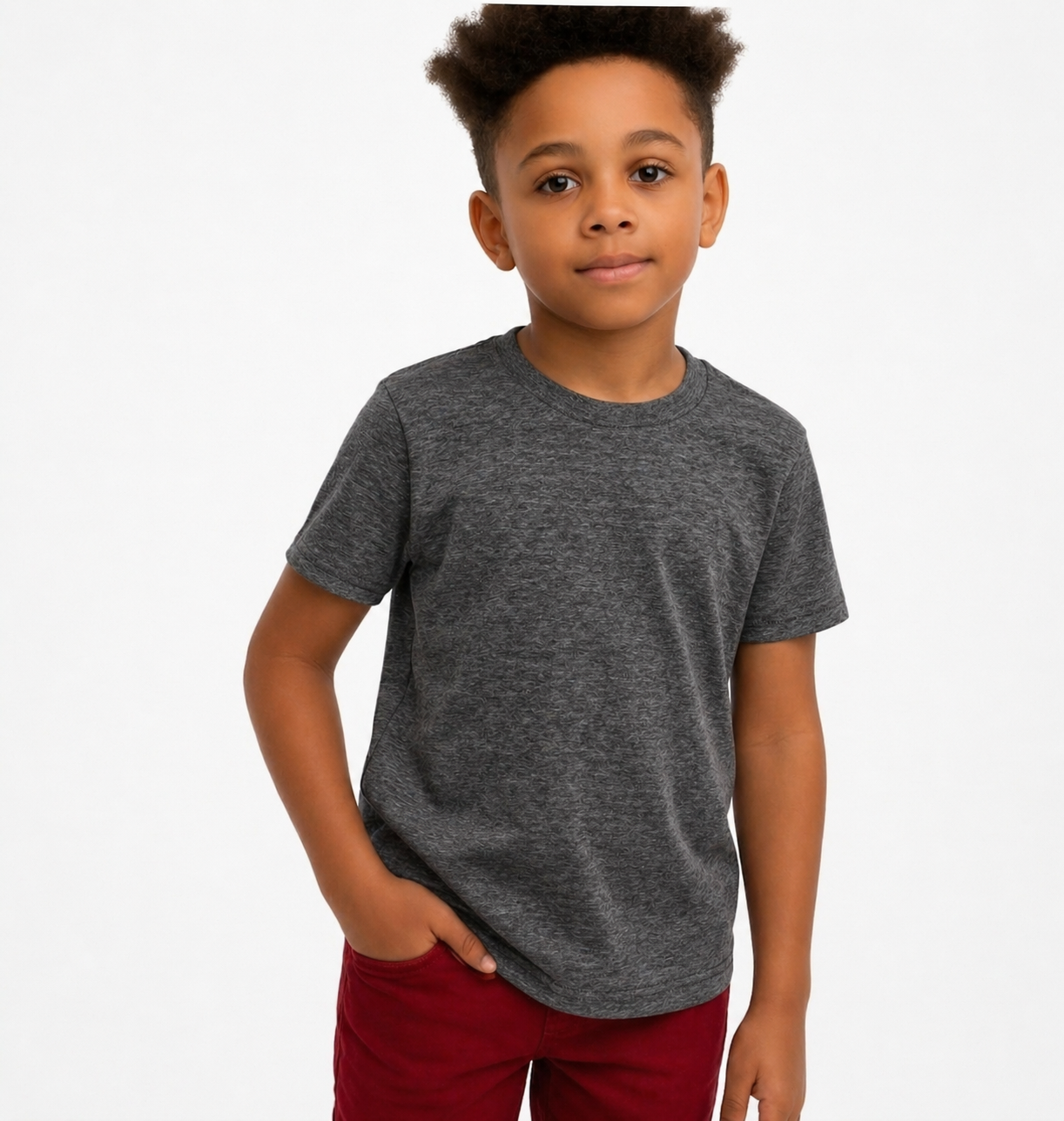 Child wearing a gray t-shirt and red shorts on a white background