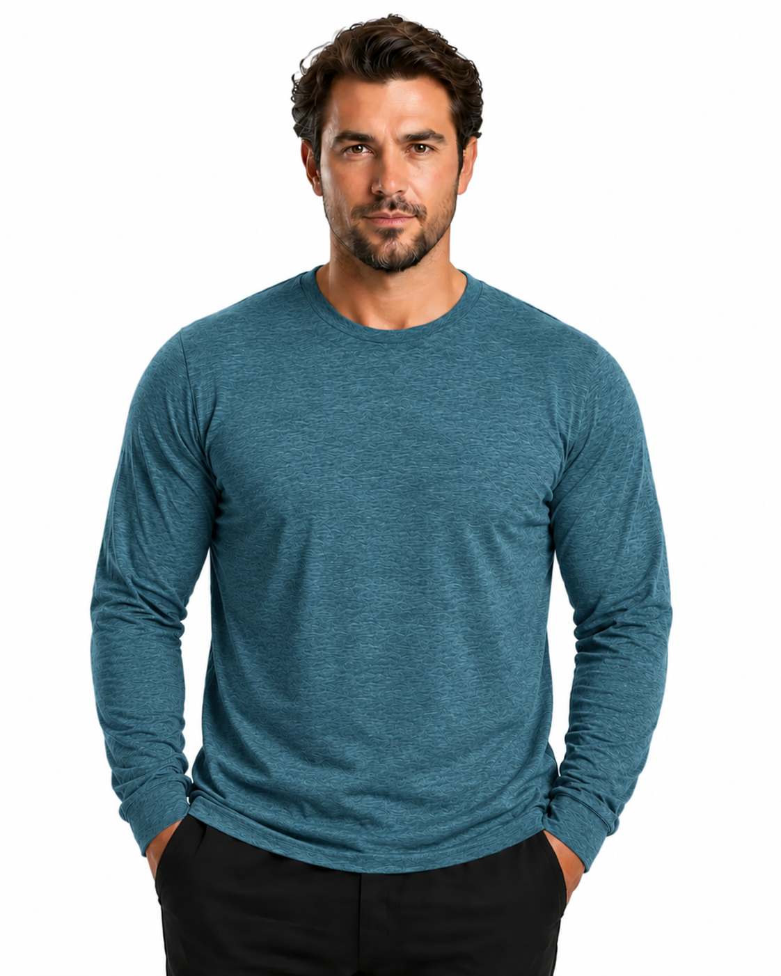 A man wearing a heathered teal blue long-sleeve crewneck shirt, paired with black pants, standing against a solid white background.