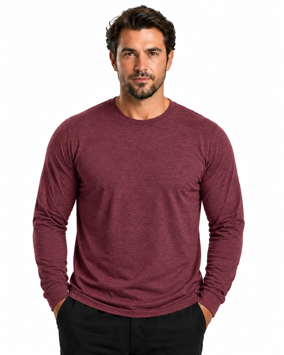 A man wearing a heathered burgundy long-sleeve crewneck shirt and black pants, standing against a plain white background.