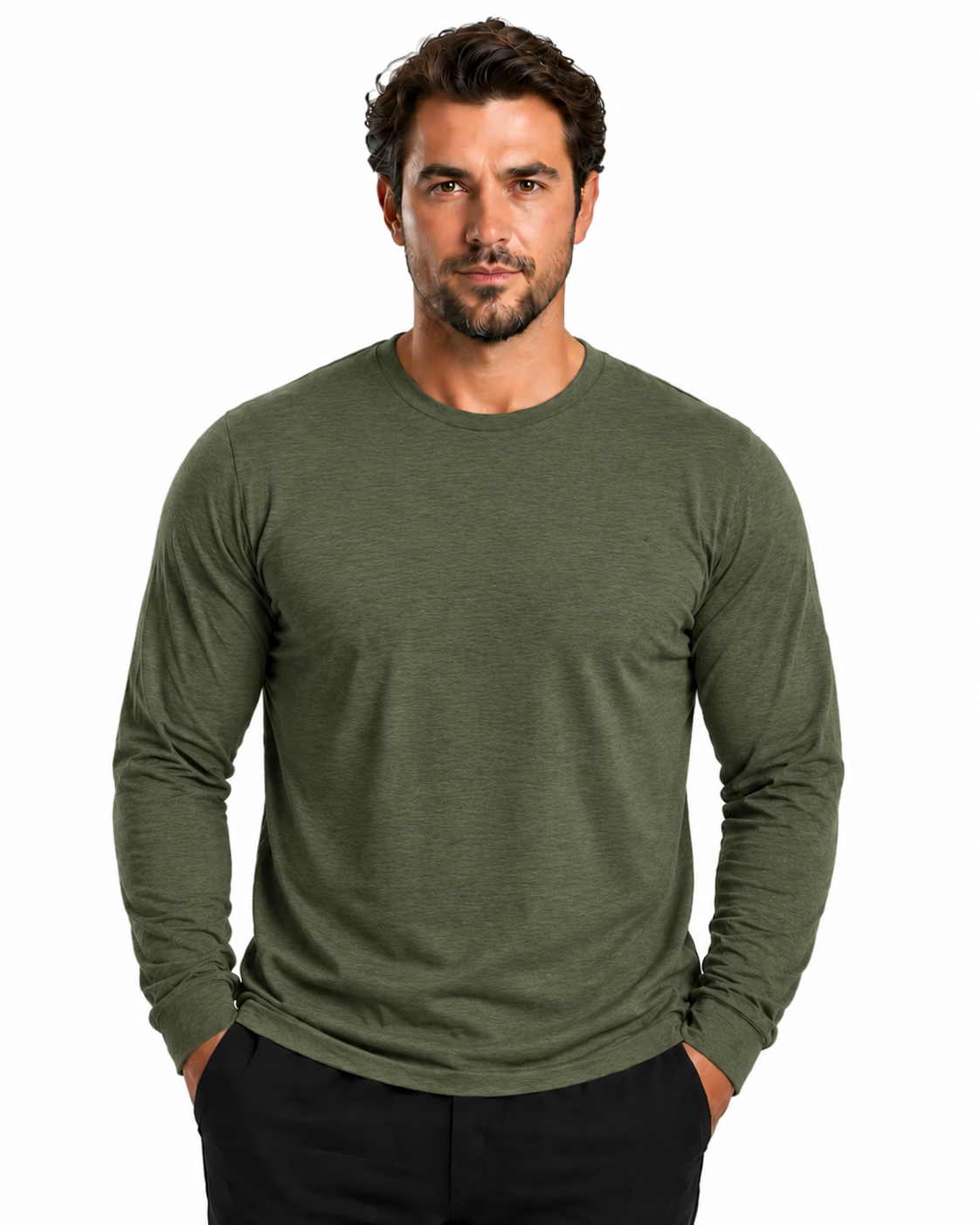 A man wearing a long-sleeve crewneck shirt in olive green, paired with black pants, standing against a solid white background.