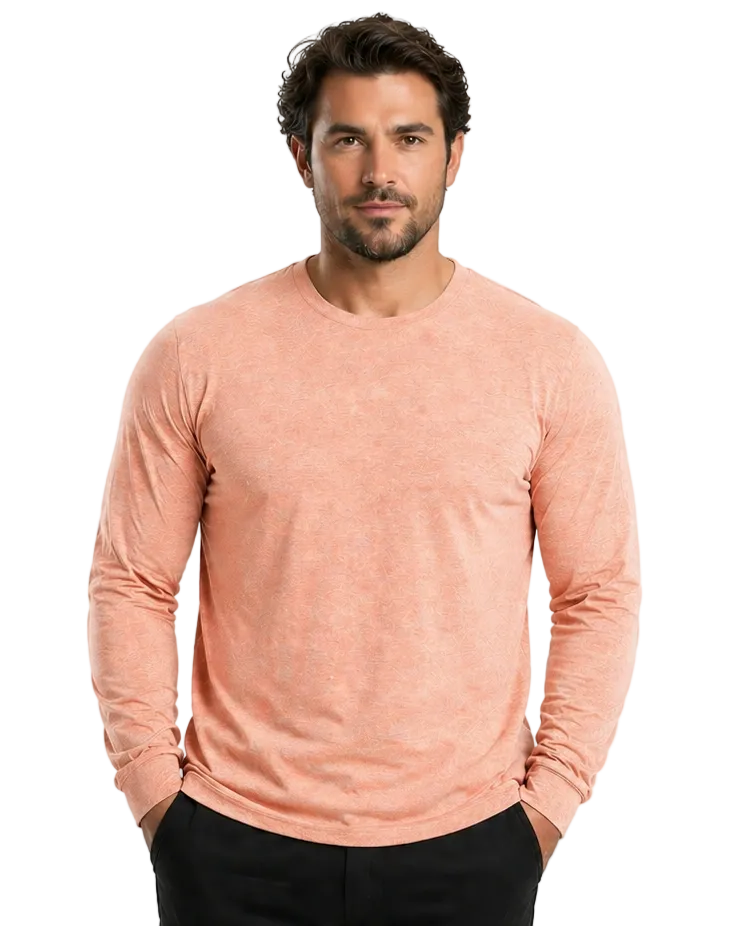 Man wearing a peach-colored long-sleeve shirt on a white background