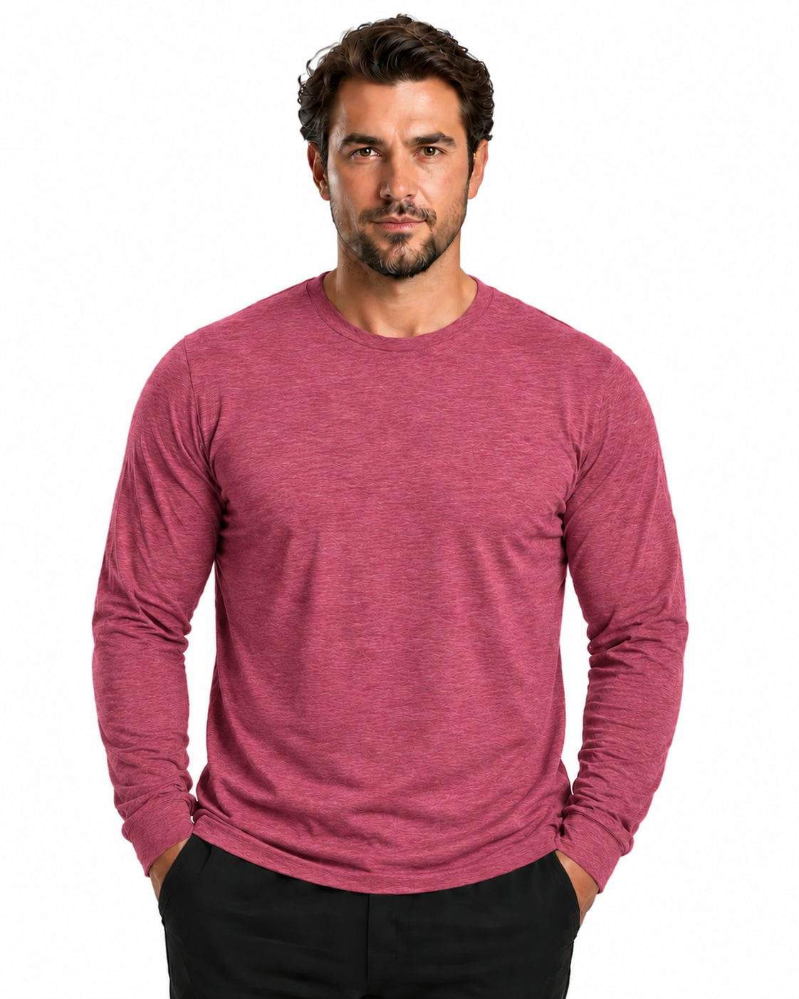 A man wearing a heathered dusty rose long-sleeve crewneck shirt and black pants, standing against a plain white background.