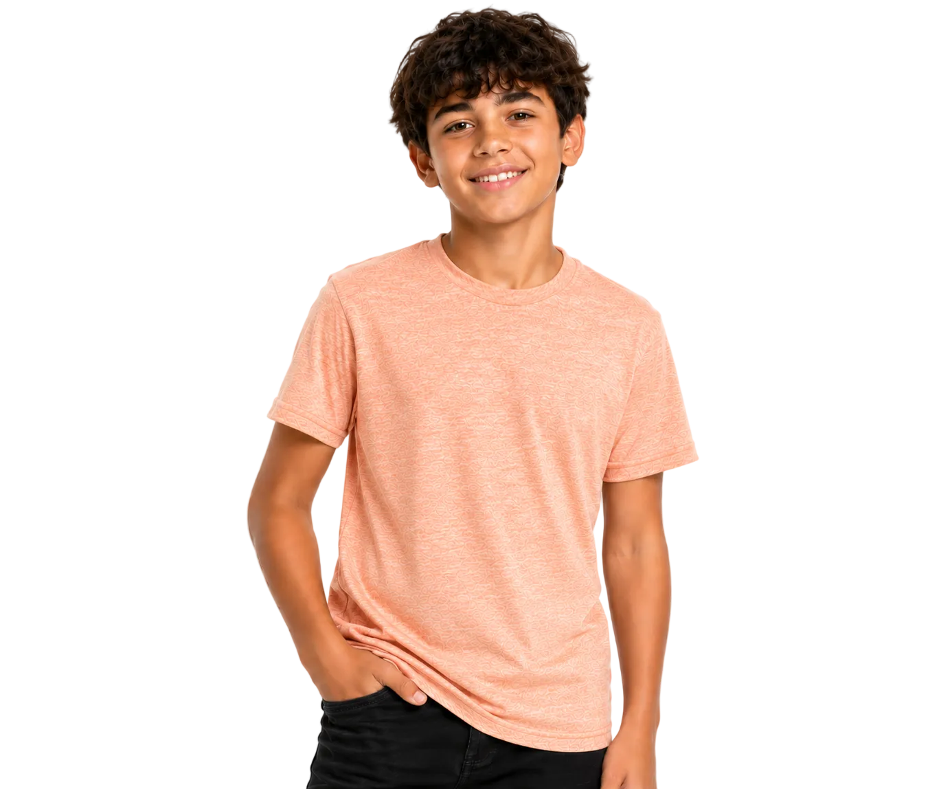 A smiling young man with curly brown hair wearing a heathered peach short-sleeve crewneck t-shirt and black pants, standing against a solid white background.