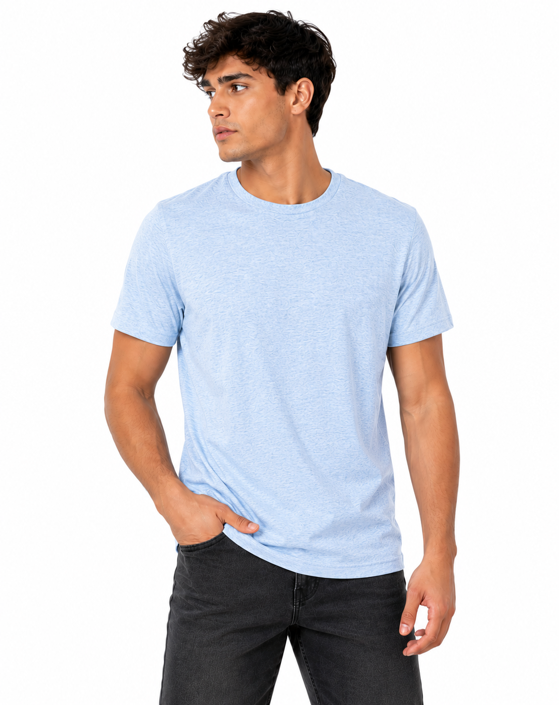 A man wearing a light blue heather crewneck t-shirt and dark gray jeans, standing against a plain white background.