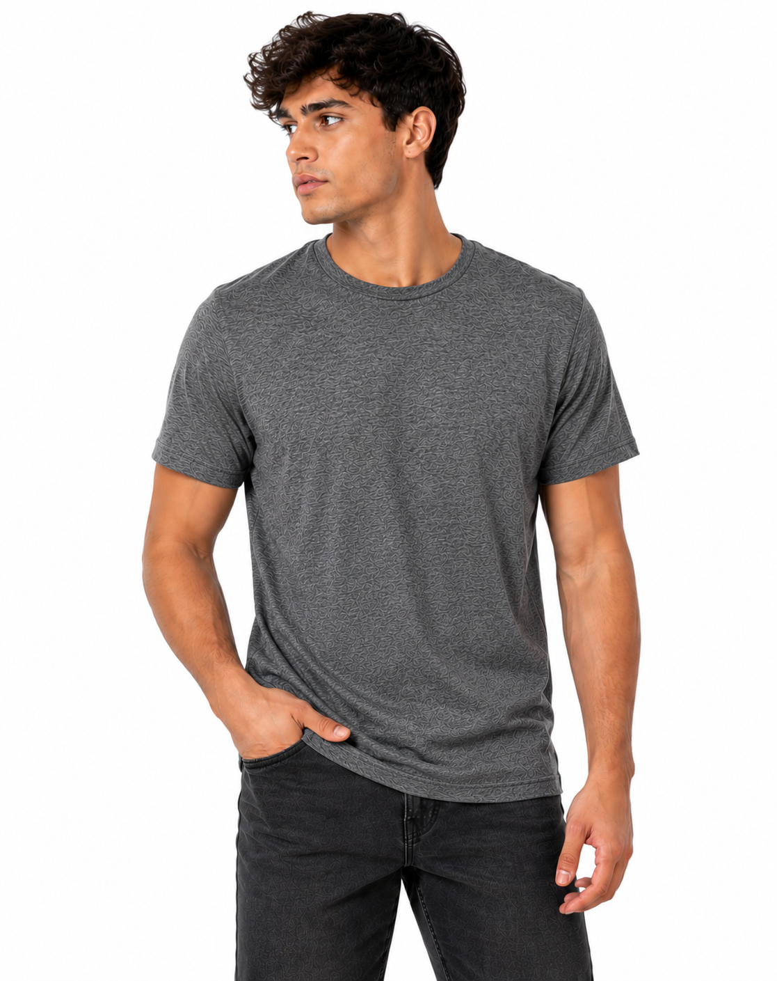 A man wearing a dark heather gray crewneck t-shirt and dark gray jeans, standing against a plain white background.