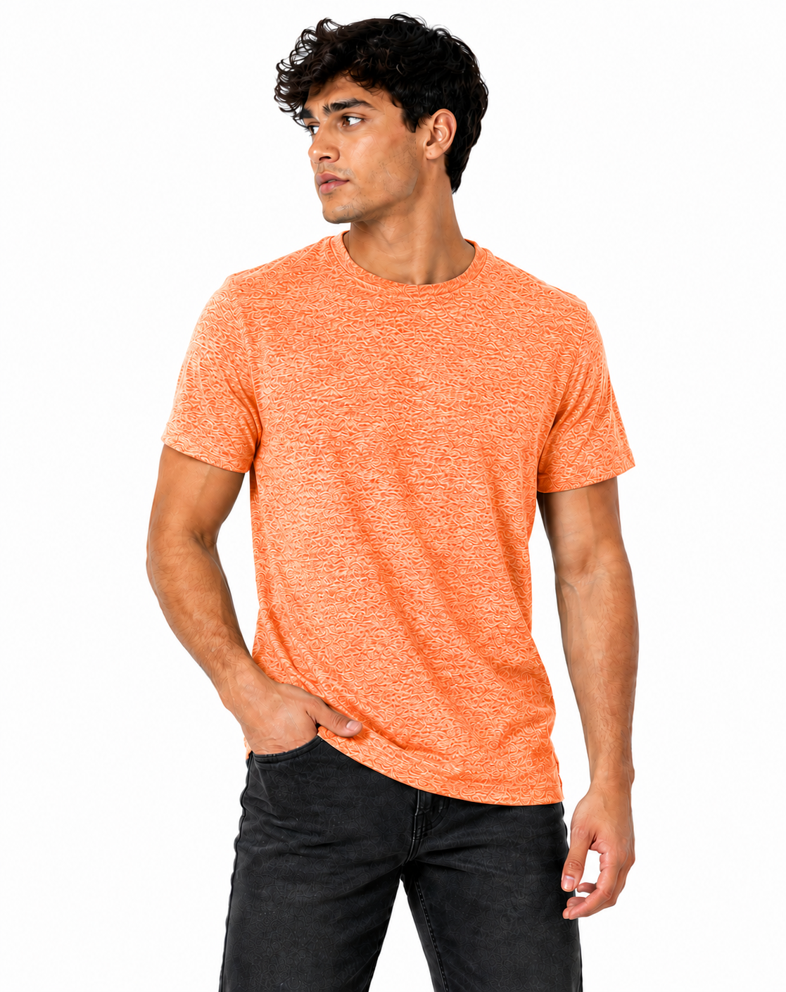 A man wearing a heathered orange crewneck t-shirt and dark gray jeans, standing against a plain white background.