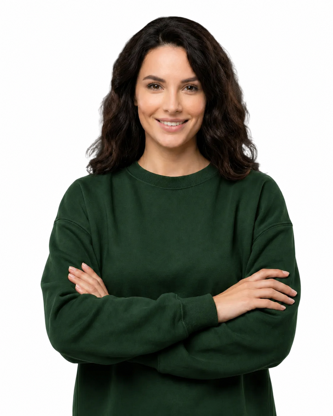 Woman wearing a green sweater with arms crossed on a white background