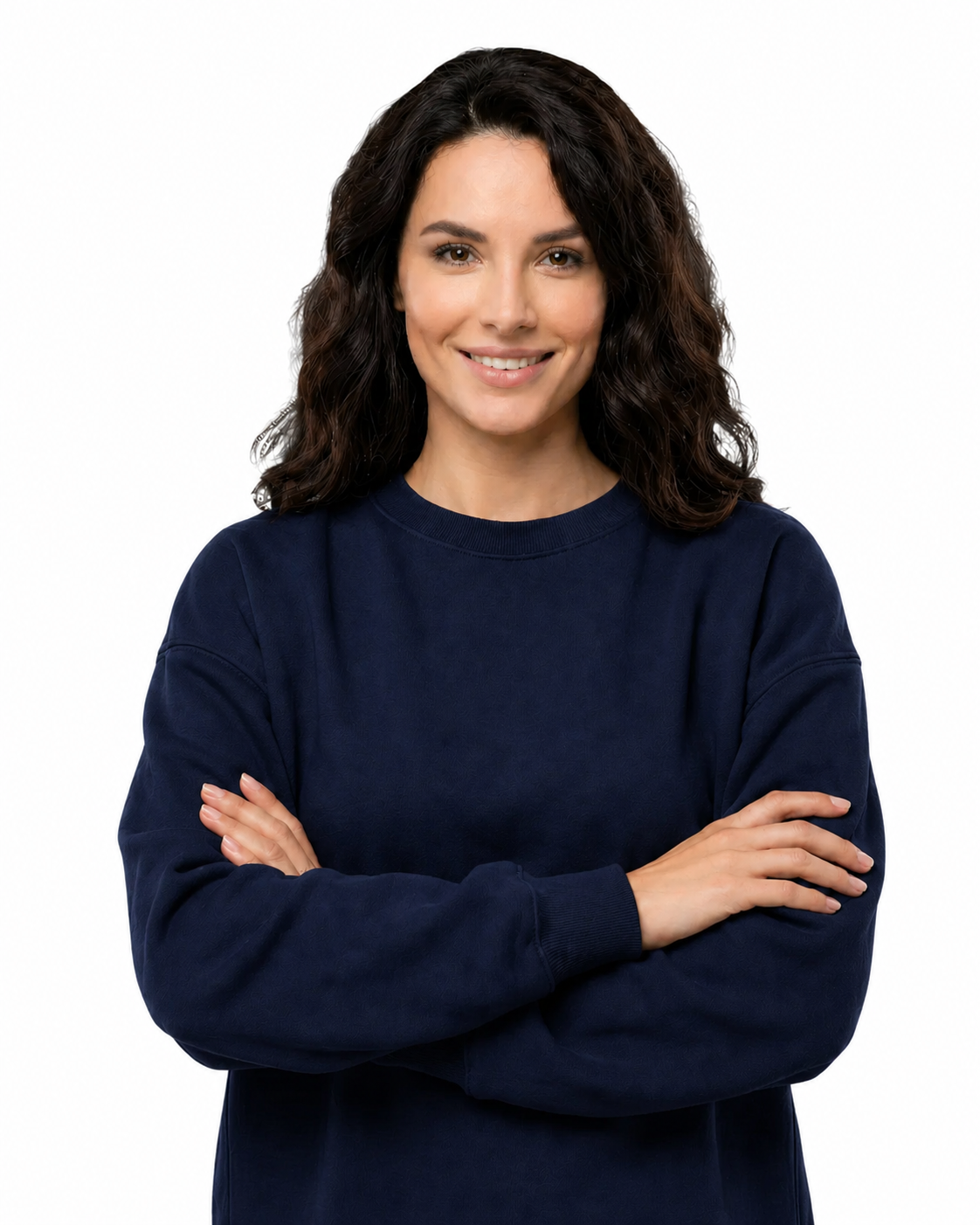 Woman wearing a navy blue sweater with arms crossed on a white background