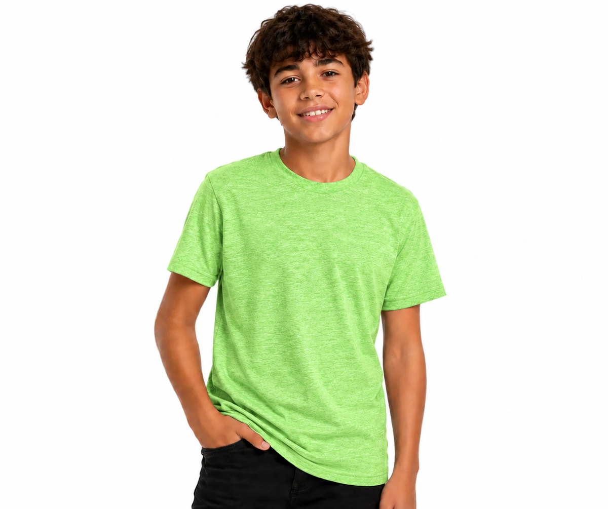 A smiling young man with curly brown hair wearing a bright lime green heathered short-sleeve crewneck t-shirt and black pants, standing against a solid white background.
