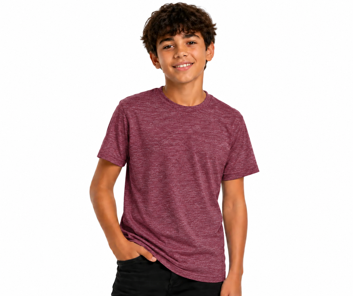 A smiling young man with curly brown hair wearing a heathered maroon crewneck t-shirt and black pants, standing against a solid white background.